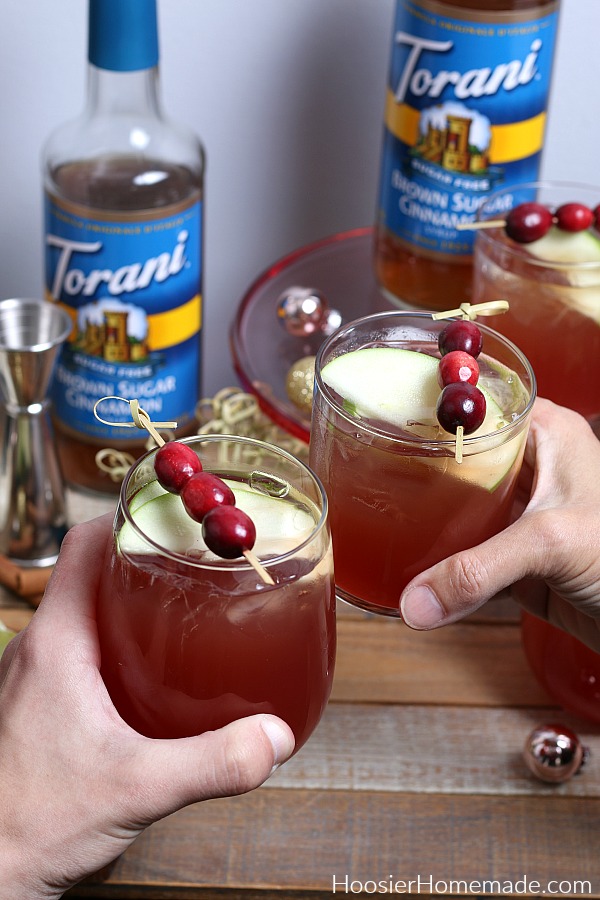 Two people enjoying Cranberry Apple Spritzer