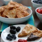 Wow the football fans with this simple and sweet Tortilla Chip Dessert Fondue! The cinnamon and sugar tortilla chips are easy to make and the homemade caramel and Mexican chocolate sends it over the top. Oh and we can't forget the fruit for a little burst of freshness!