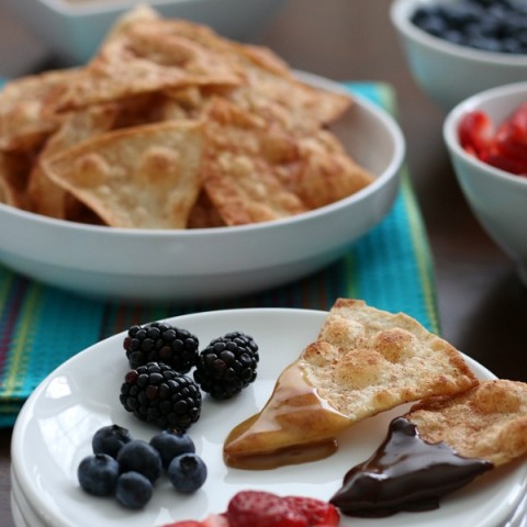 Wow the football fans with this simple and sweet Tortilla Chip Dessert Fondue! The cinnamon and sugar tortilla chips are easy to make and the homemade caramel and Mexican chocolate sends it over the top. Oh and we can't forget the fruit for a little burst of freshness!
