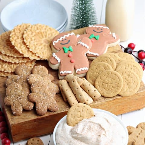 eggnog dip with gingerbread cookies in white bowl