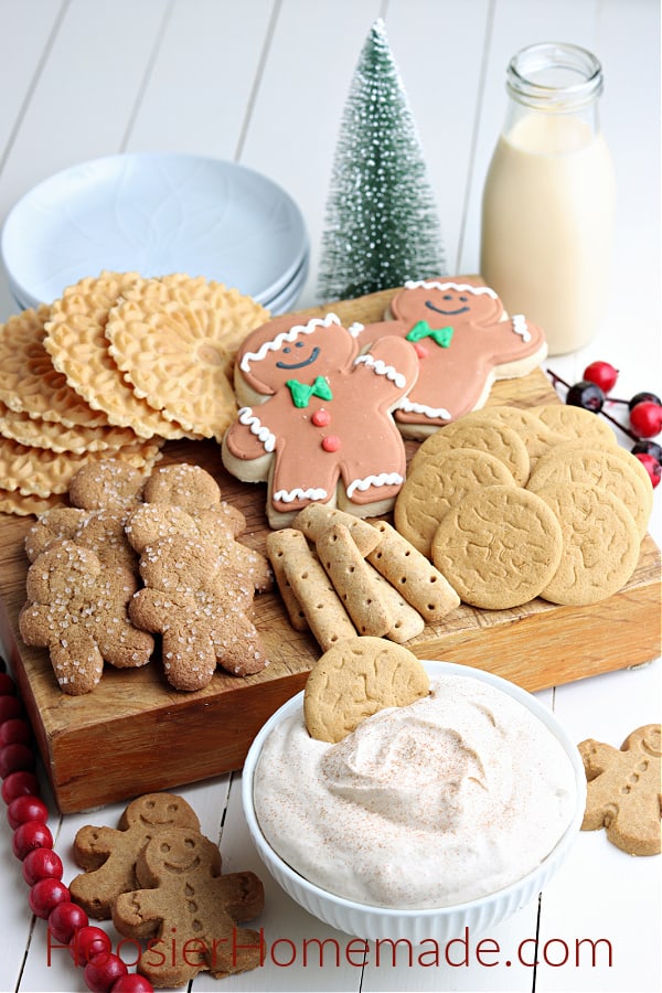 eggnog dip with gingerbread cookies in white bowl