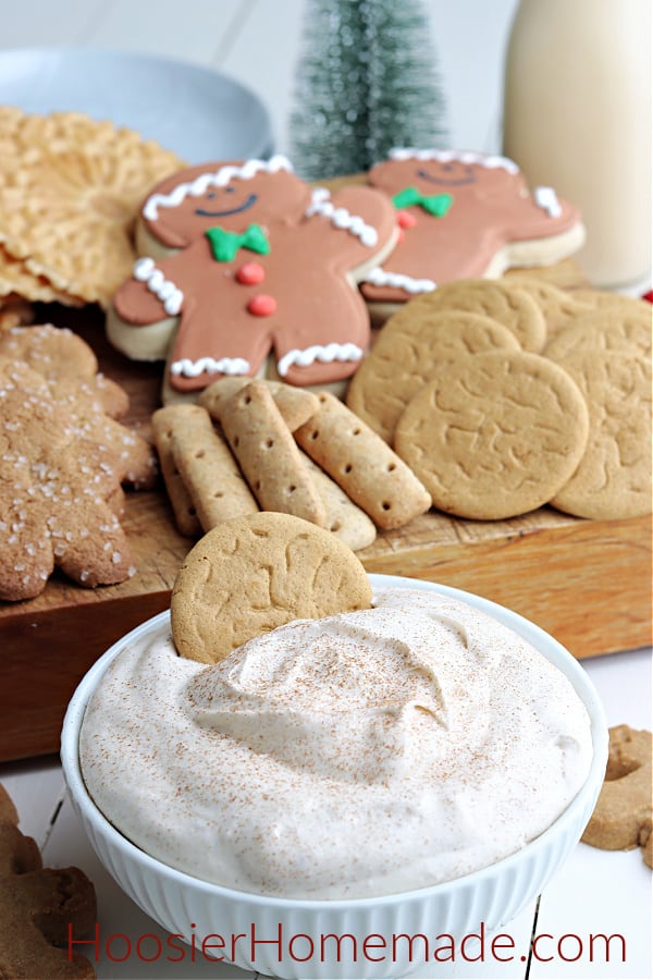 eggnog dip is a white bowl with cookies