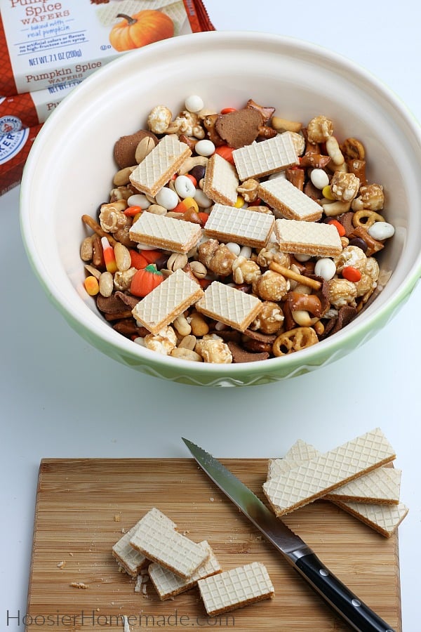 adding cookies to fall snack mix