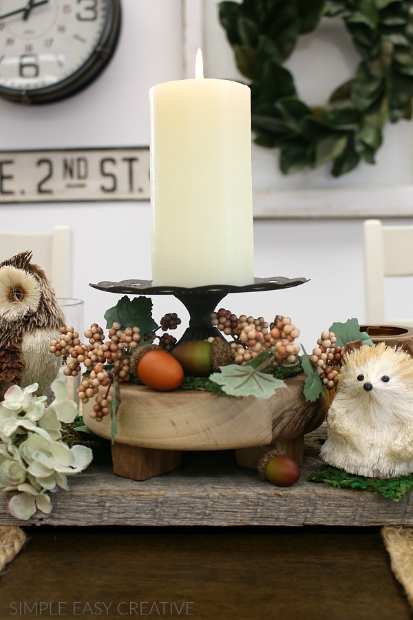 Adding candles to Fall Table Decorations