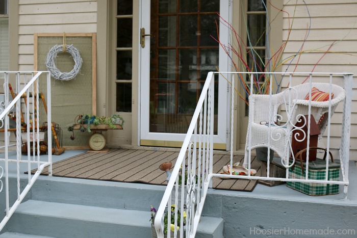 Front Porch Decorating on a Budget. Beautiful porch paint in a shade of gray.