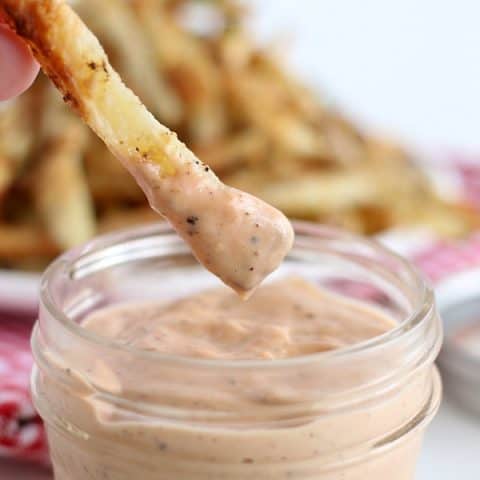 French Fry dipping in Fry Sauce