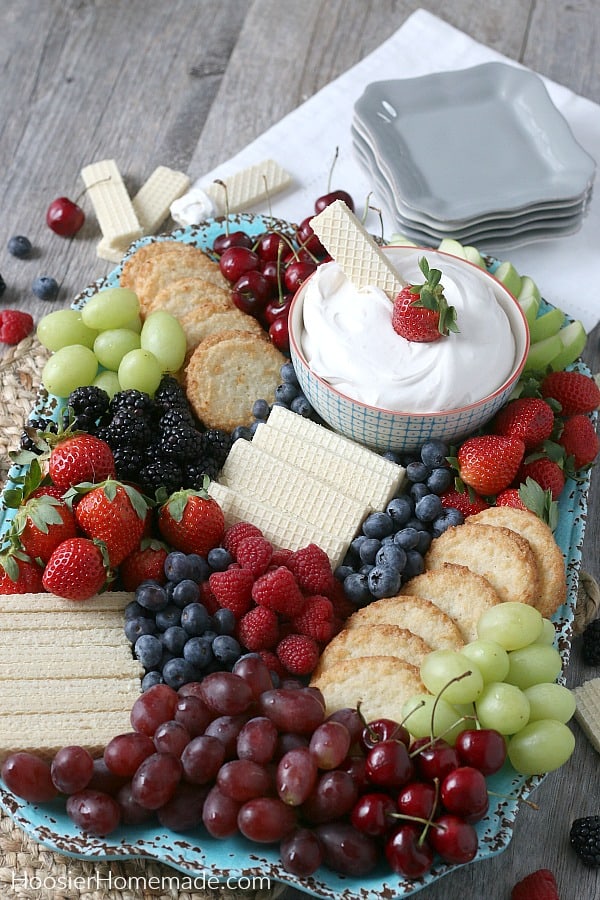 Healthy Fruit Dip with fruit and cookies on board