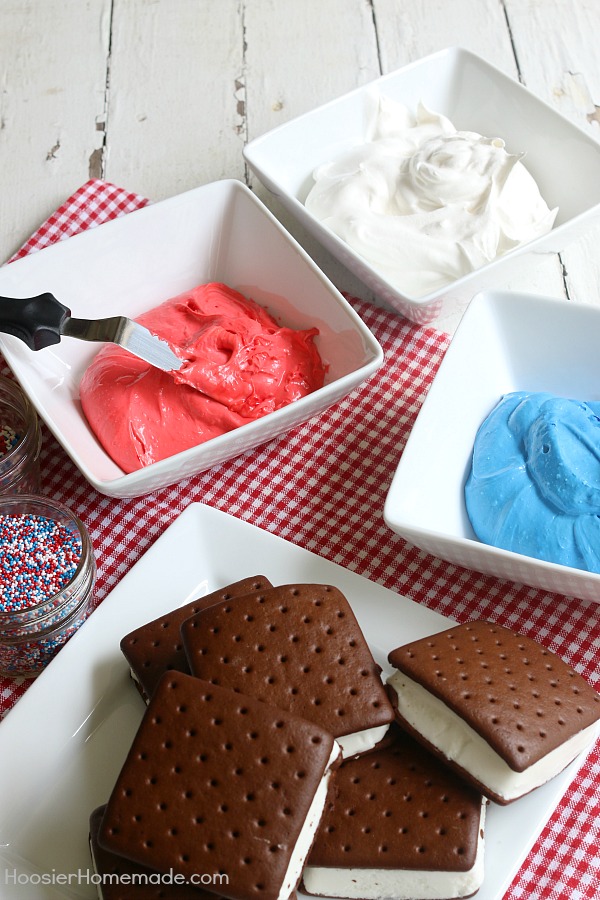 Ice Cream Sandwiches Cake -- this fun red, white and blue ice cream sandwiches cake is super easy and really fun for your 4th of July Celebrations! Just 4 simple ingredients and you have a show-stopping dessert! 