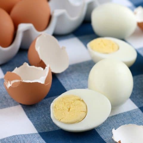 Closeup of Instant Pot hard boiled eggs peeled on a blue napkin