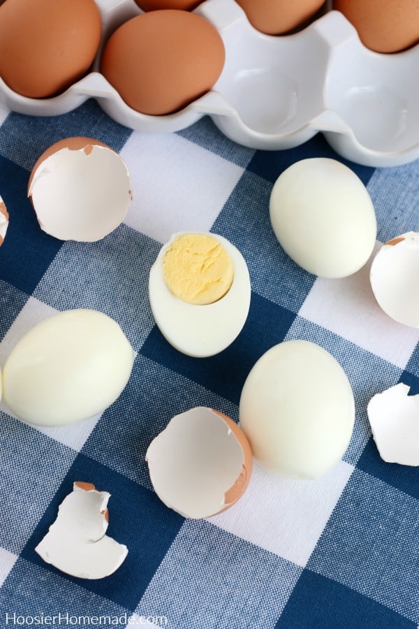 Hard boiled eggs peeled on blue napkin