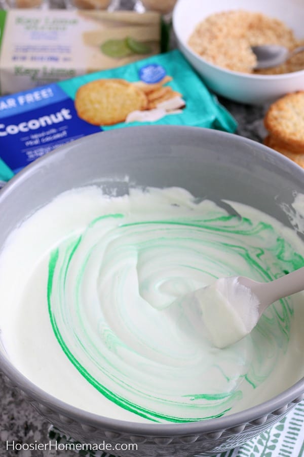 Mixing pudding shots in large bowl