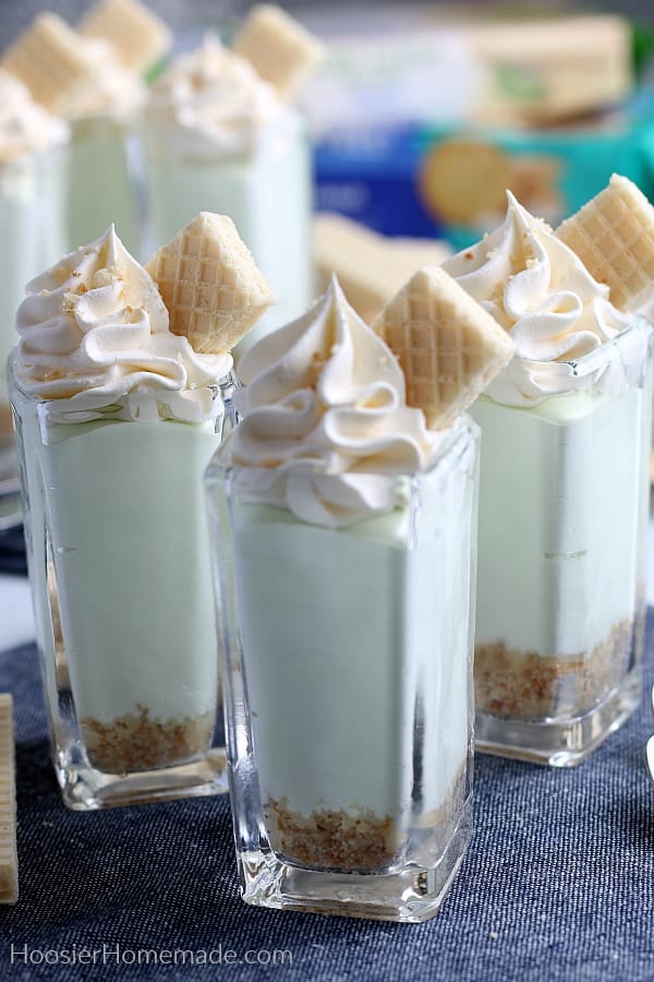 Pudding shots in shot glasses with whip cream