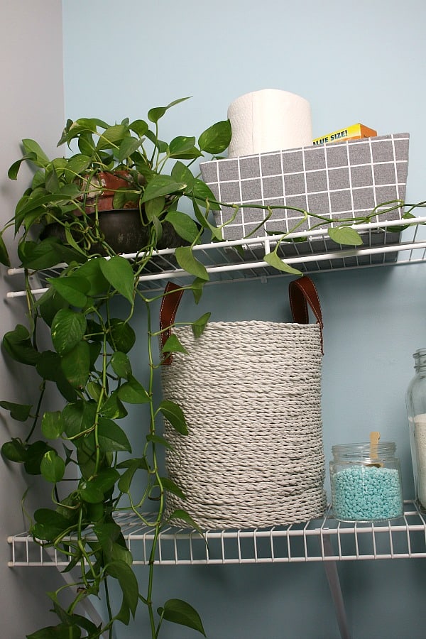 Basket on shelf in small laundry room