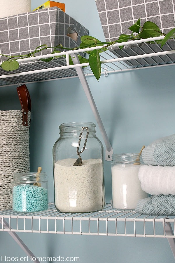 Laundry soap on shelf in small laundry room