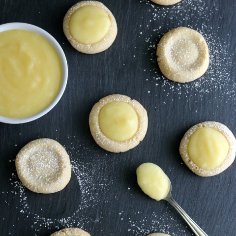 Lemon Drop Cookies - buttery cookies filled with homemade lemon curd! Perfect for Easter Dessert, a Spring treat, and are perfect for a baby or bridal shower! Pin to your Recipe Board!