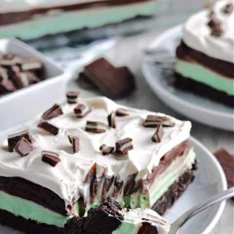 layered mint dessert on white plate with fork