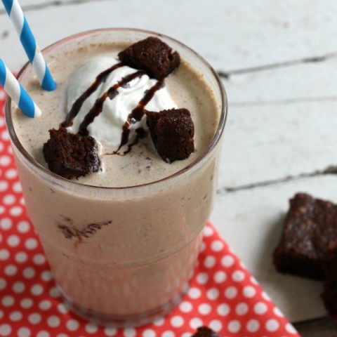 Mocha Brownie Shake - luscious, refreshing shake made with Mocha Iced Coffee, Ice Cream and Brownies - YUM! Top with a dollop of whipped topping, drizzle of chocolate syrup and a few brownie chunks and you have a delicious treat to enjoy at home! Be sure to save the recipe by pinning to your Recipe Board!