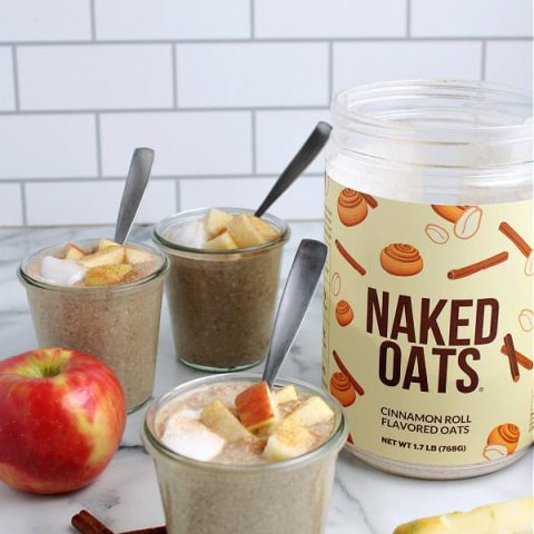 cinnamon roll naked oats from Naked Nutrition made in jars and topped with greek yogurt and apples