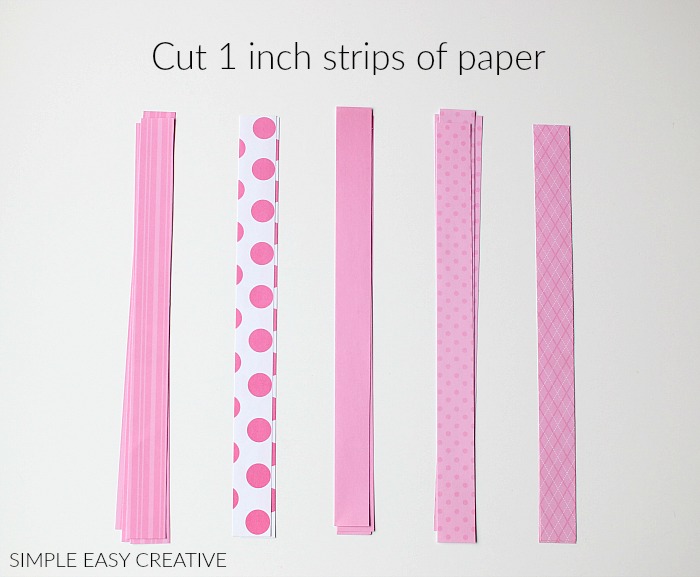 Cut pieces of scrapbook paper 1 inch wide