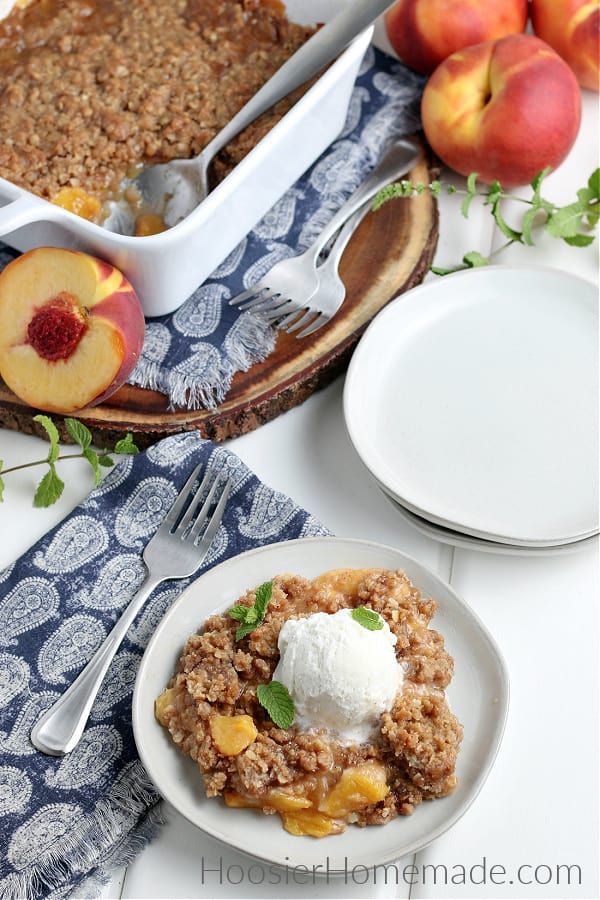 Peach Crisp on plate with vanilla ice cream 