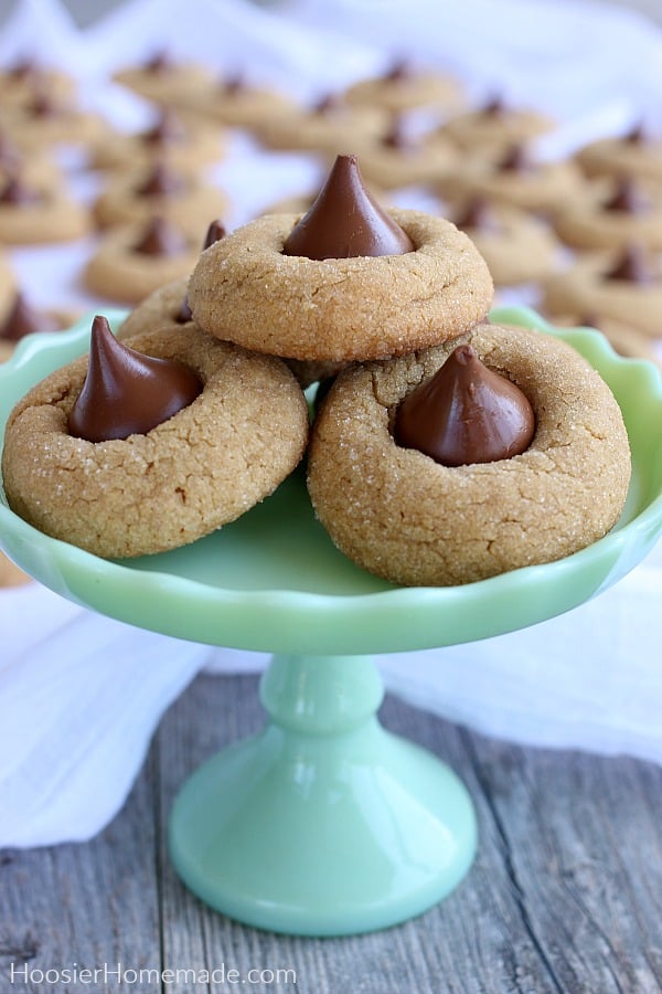 Peanut Butter Blossoms cookies on green stand
