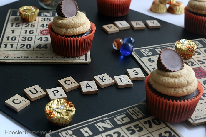 PEANUT BUTTER CUP CUPCAKES -- These Chocolate Cupcakes start with a moist, delicious recipe that includes peanut butter cups in the cupcakes, and topped with a creamy Peanut Butter Frosting! And of course, another Peanut Butter Cup on top!