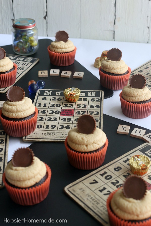 PEANUT BUTTER CUP CUPCAKES -- These Chocolate Cupcakes start with a moist, delicious recipe that includes peanut butter cups in the cupcakes, and topped with a creamy Peanut Butter Frosting! And of course, another Peanut Butter Cup on top!