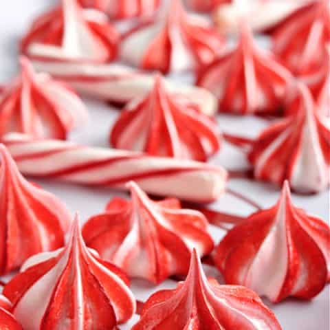 red and white meringue cookies on tray