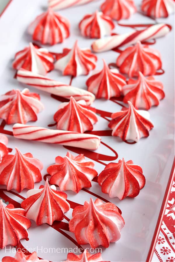 red and white meringues on tray