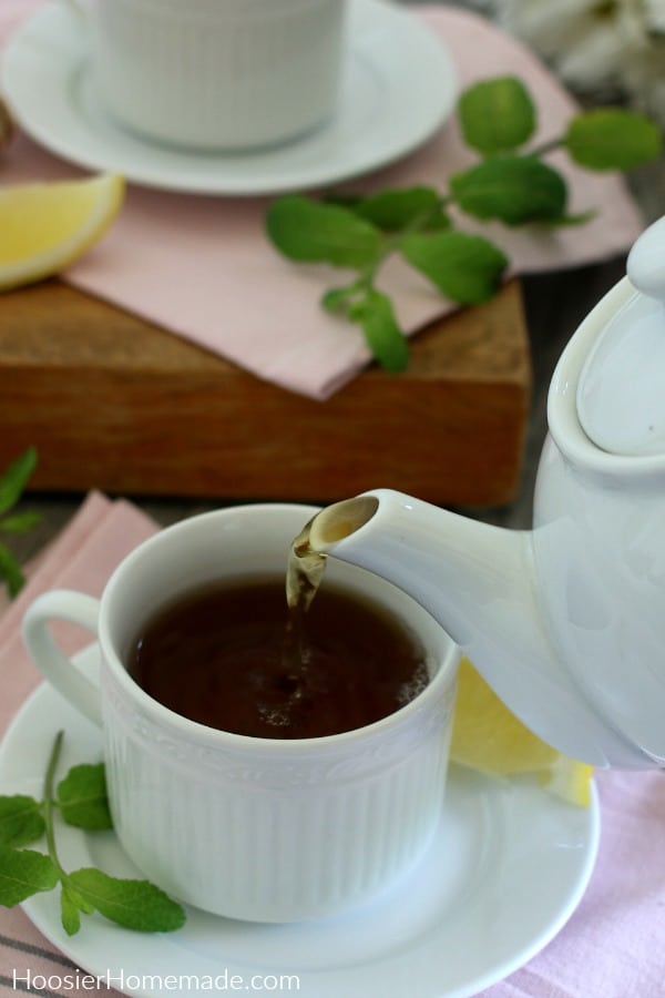 Pouring tea into cup