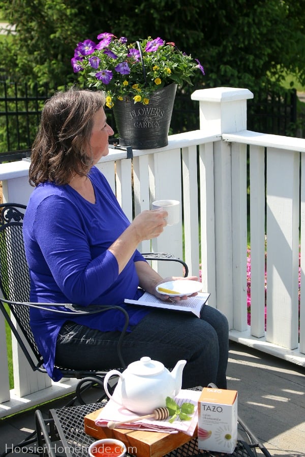 Women drinking tea on deck