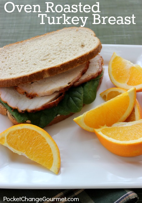 Sliced Turkey on a bread with oranges on the side