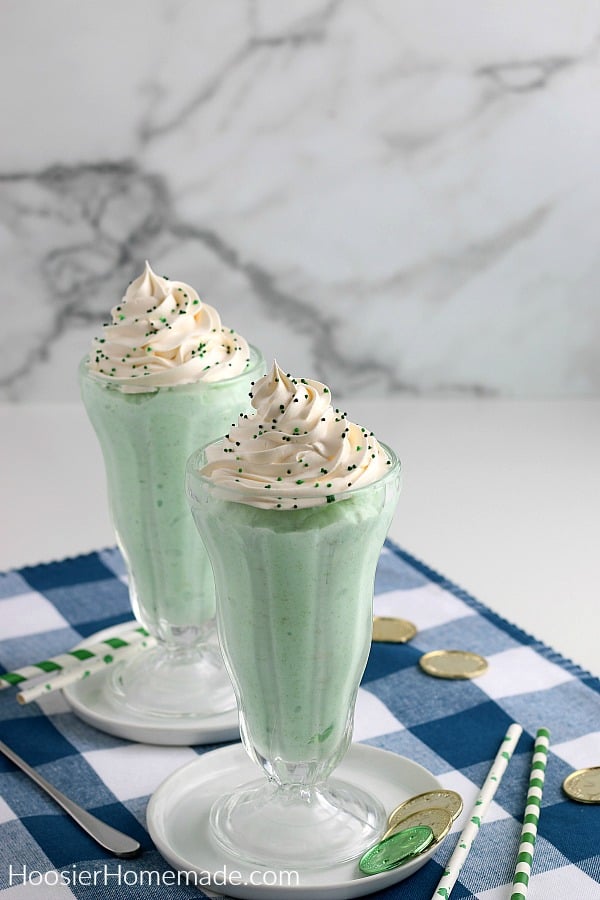 Shamrock Shake in tall glass on blue cloth