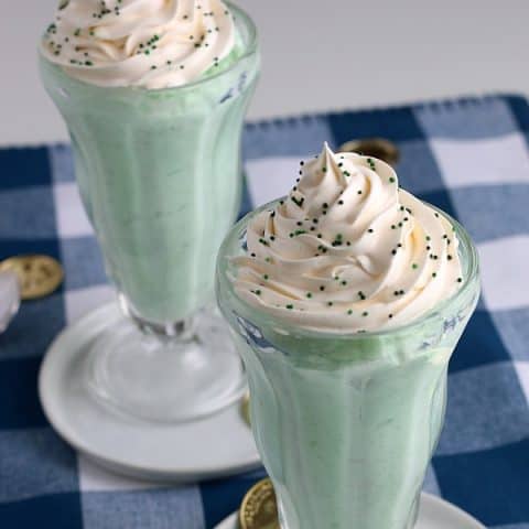 Shamrock Shake in tall glass with whip cream