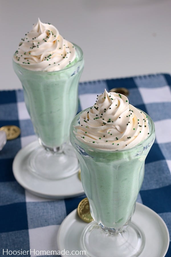 Shamrock Shake in tall glass with whip cream