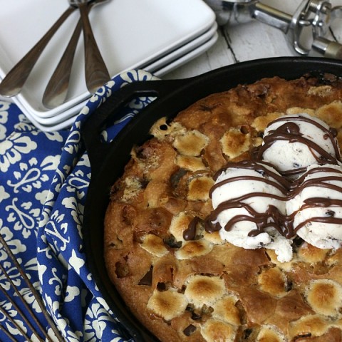 SKILLET COOKIE -- Warm right from the oven with a big scoop of Ice Cream! YUM! This Skillet Cookie Recipe is filled with Chocolate Chunks and Marshmallows!