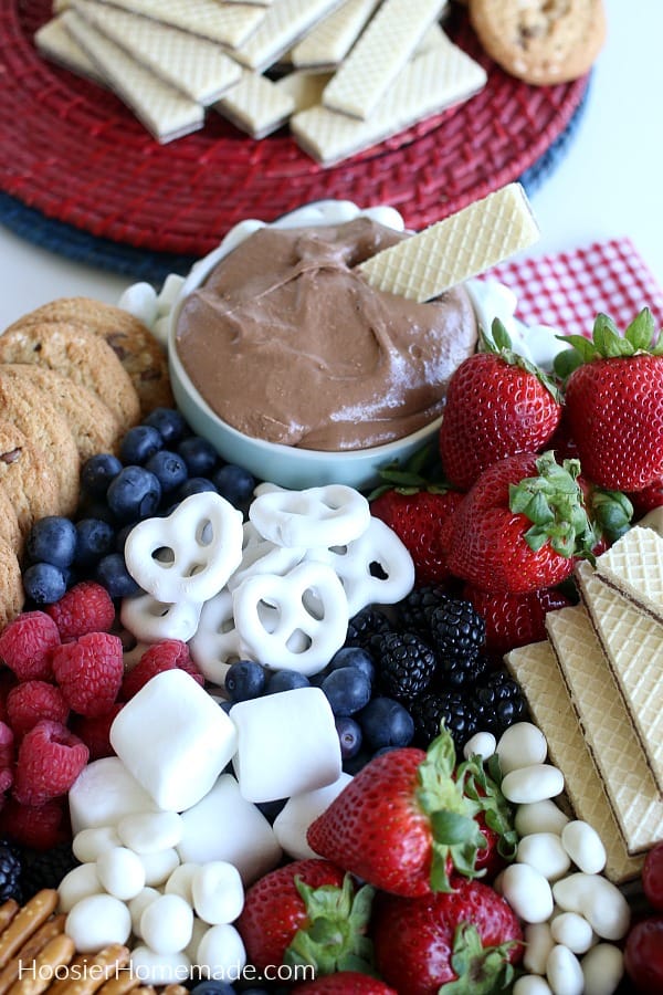 S'mores Dip with cookies, fruit and pretzels on a plate