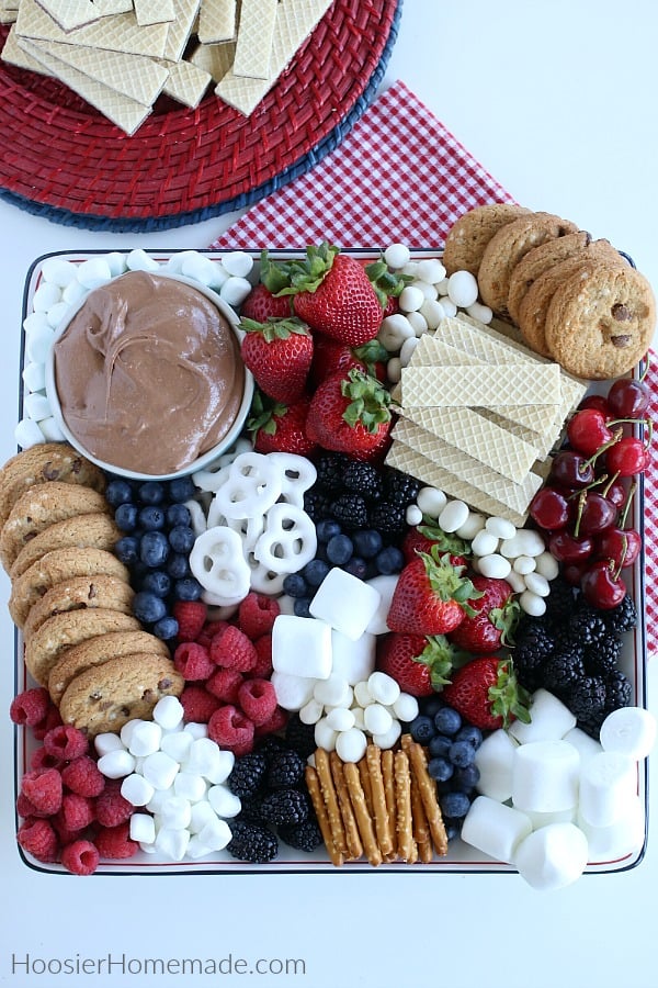 S'mores Dip on tray with fruit, cookies and pretzels