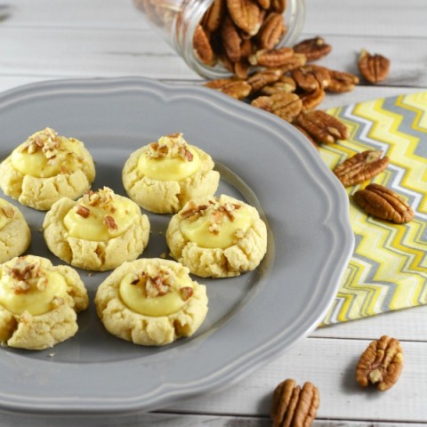 These simple thumbprint cookies start with a shortbread cookie and the filling is creamy vanilla like a cream puff. A sprinkle of pecans top them off. AND they have less sugar in them too!