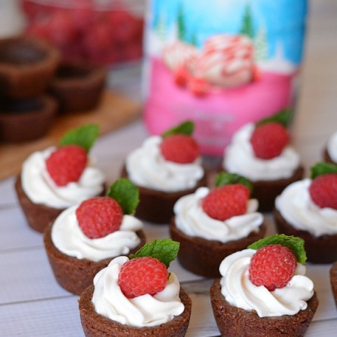 Chocolate Cookie Cups filled with White Chocolate Raspberry Cream - chocolate cookie cups that are similar to a shortbread cookie. Not too sweat, not super moist, but full of rich chocolate flavor. Top them with the super light, airy, fluffy White Chocolate Raspberry Cream and it's heaven!